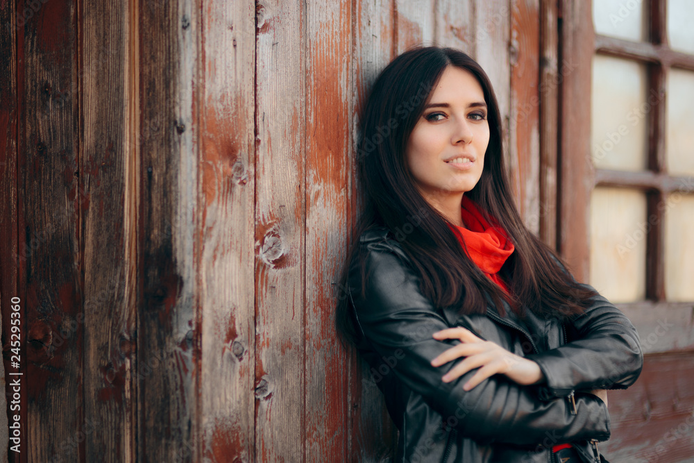 Fototapeta premium Cool Young Woman Outdoor Portrait Wearing Leather Jacket 