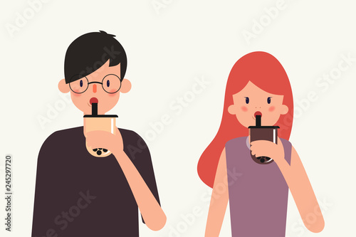 Young people drink bubble milk tea. Taiwanese famous and popular drink with black pearls.