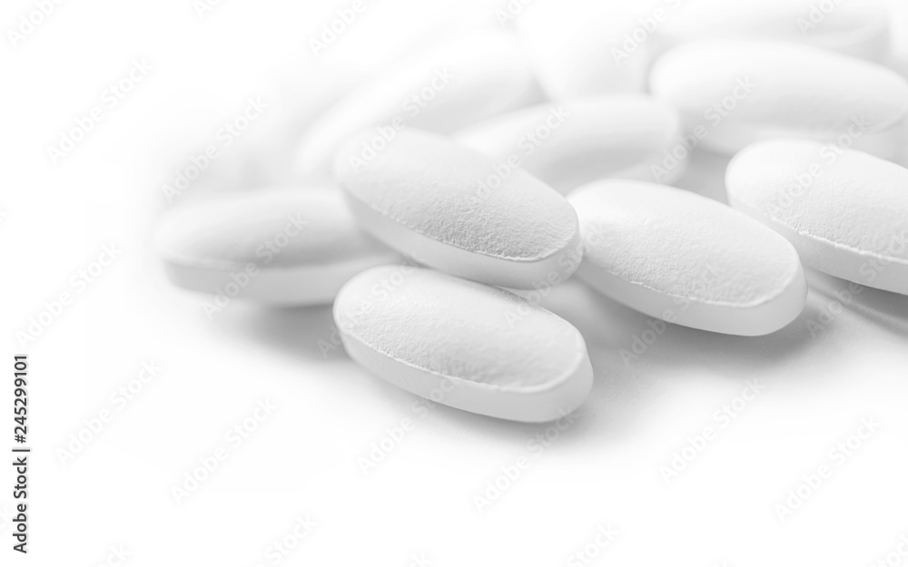white medicine tablets in selective focus white medicine tablets in selective focus