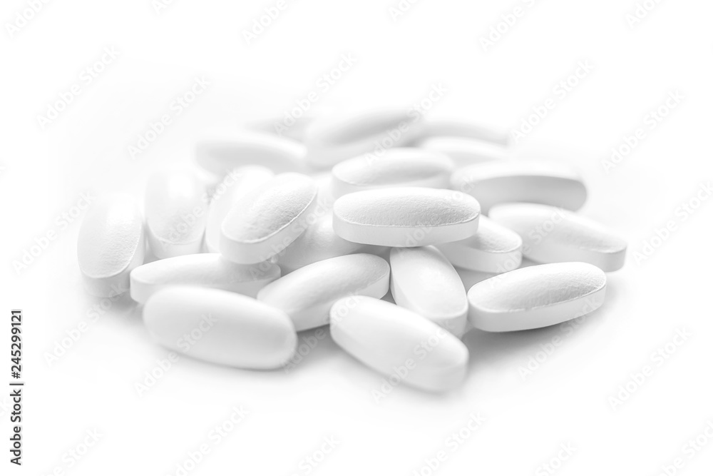 white medicine tablets in selective focus white medicine tablets in selective focus