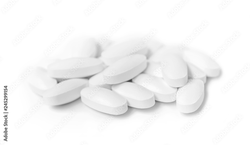 white medicine tablets in selective focus white medicine tablets in selective focus