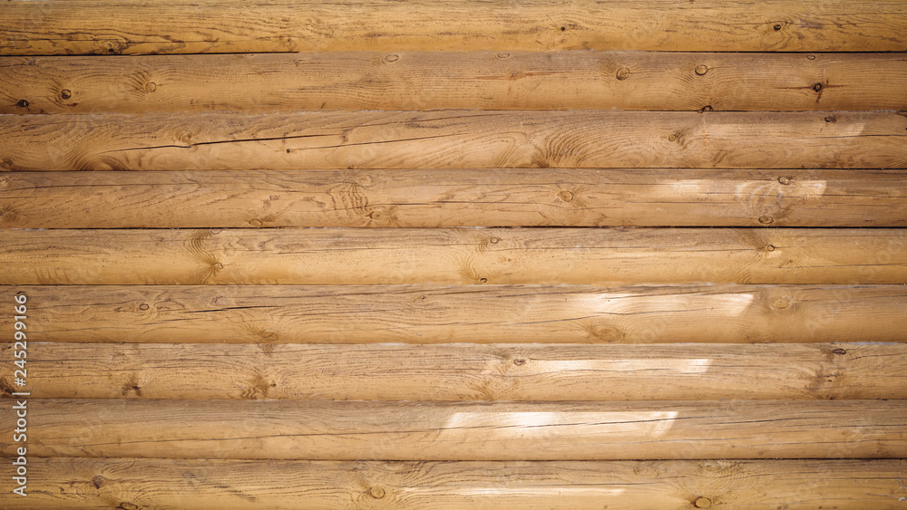 Fototapeta premium Unpainted light wooden cabin wall texture background