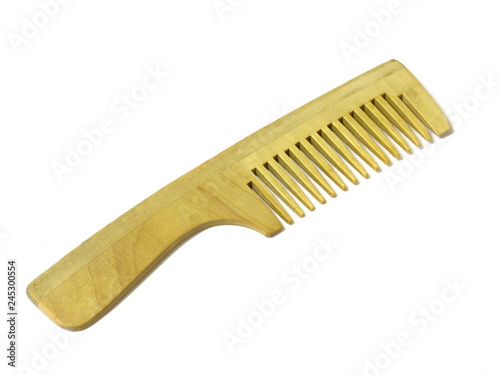 Wooden hairbrush on white isolated background