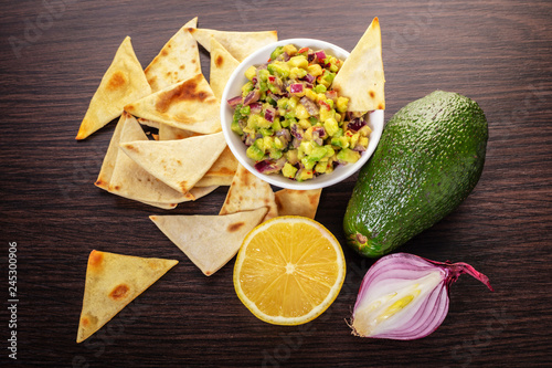 guacamole with corn chips closeup
