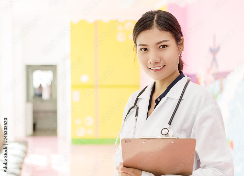 Friendly smiling young asian medicine doctor woman with stethoscope holding clinical record in clinic ,hospital. Close up portrait with copy space.Healthcare and medical concept Friendly smiling young asian medicine doctor woman with stethoscope holding clinical record in clinic ,hospital. Close up portrait with copy space.Healthcare and medical concept