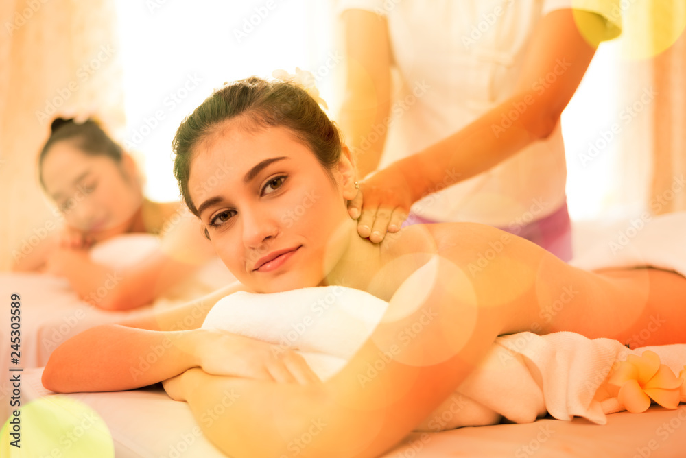 Young healthy asian woman lying relax in spa salon.Traditional Thai oriental aromatherapy and Massage beauty treatments.Recreation vitality wellness wellbeing resort hotel lifestyle leisure Young healthy asian woman lying relax in spa salon.Traditional Thai oriental aromatherapy and Massage beauty treatments.Recreation vitality wellness wellbeing resort hotel lifestyle leisure