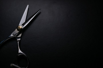 professional scissors on black background