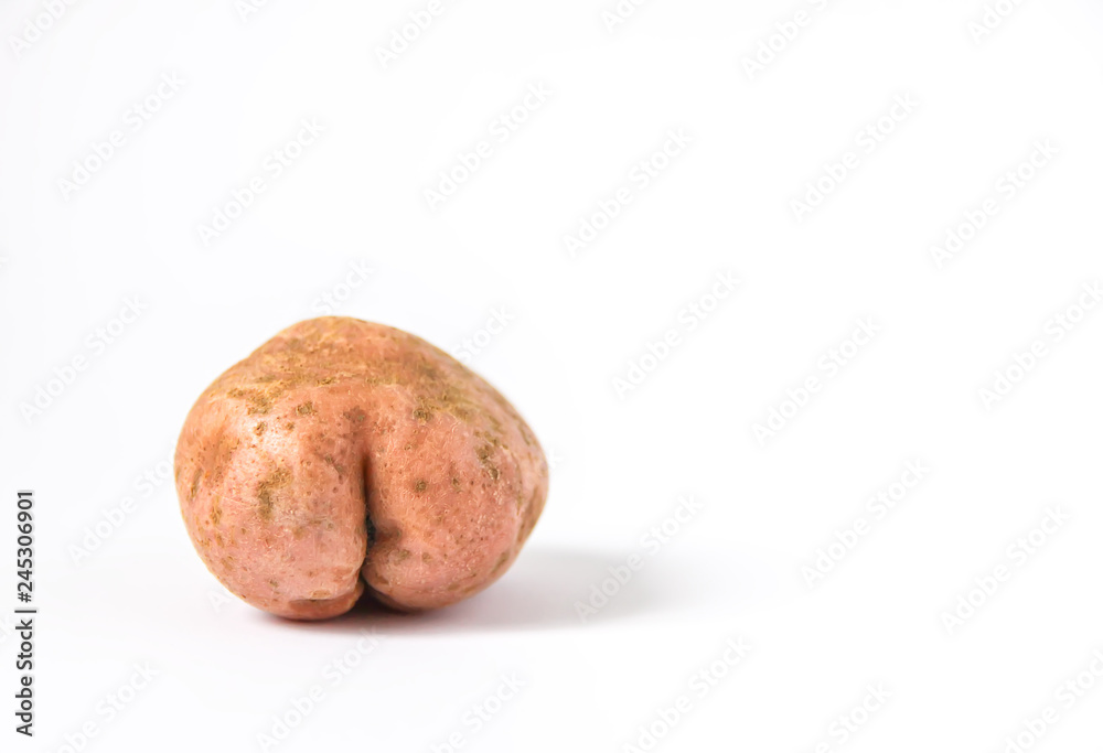 Raw funny potato in a shape of ass. Raw funny potato in a shape of ass.