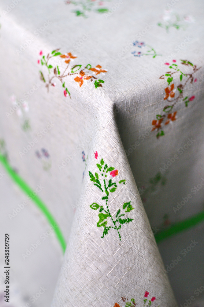 corner of a table covered with a tablecloth corner of a table covered with a tablecloth