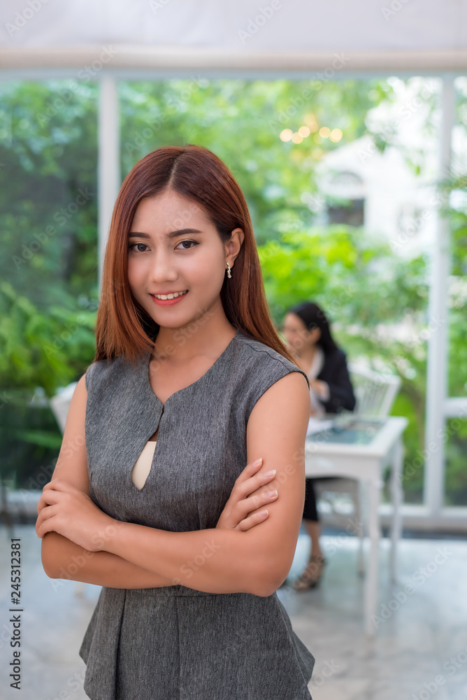 Portrait of an attractive young asian business woman at home office,background is green garden. Portrait business people for new start up business and financial concept