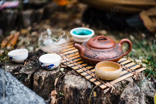 Tiny tea ceremony outdoor  on the ground in daylight