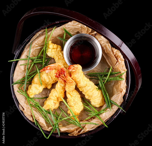 Tiger prawns in batter. Ebi tempura on dark background photo