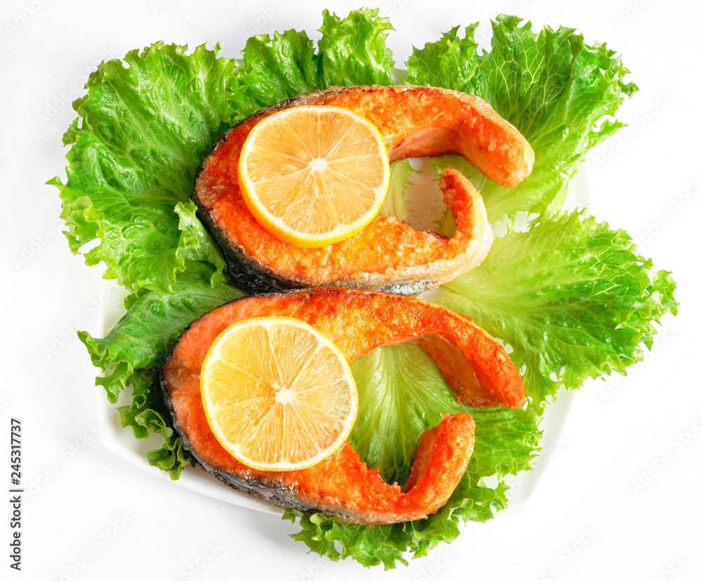 Deliciously steak of fried salmon on plate Deliciously steak of fried salmon on plate