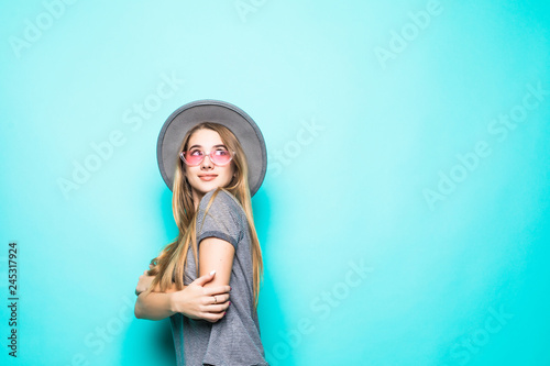 Side view of Beautiful woman with hat smiling on a background of blue sky