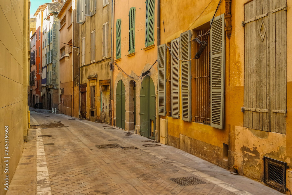 Old Narrow street and apartment buildings in Toulon, Riviera, Cote d'Azur, France