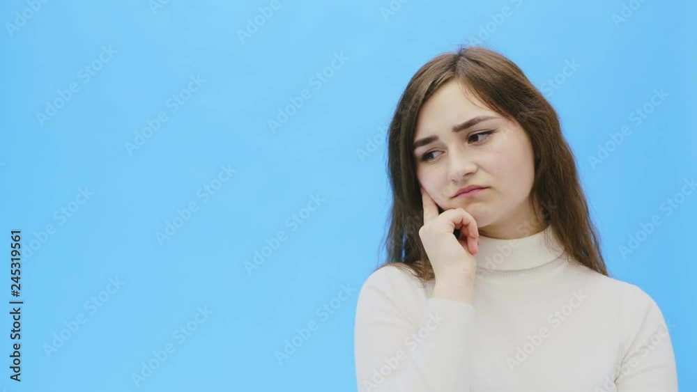 Beautiful young woman with clean, perfect skin. Portrait of beauty model with natural make-up and and having come up with something. Beautiful young woman with clean, perfect skin. Portrait of beauty model with natural make-up and and having come up with something.