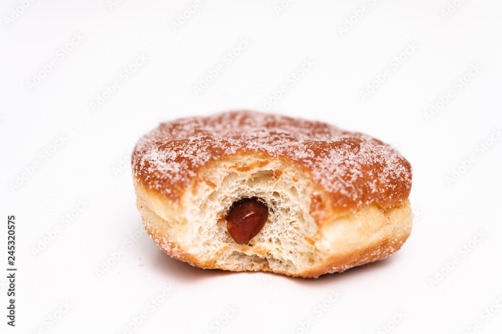 Traditional German or Austrian fried donuts with no hole, so called Krapfen, Berliner or Pfannkuchen with cinnamon sugar and filled with rose hip, raspberry or strawberry jam, party or carnival food Traditional German or Austrian fried donuts with no hole, so called Krapfen, Berliner or Pfannkuchen with cinnamon sugar and filled with rose hip, raspberry or strawberry jam, party or carnival food