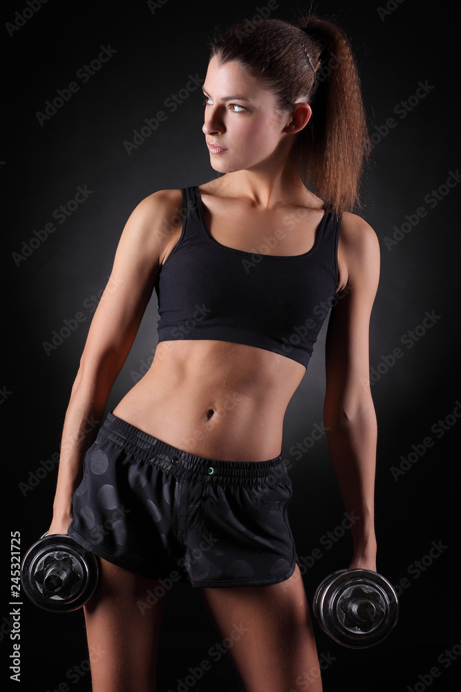fitness woman in doing exercises with dumbells. fitness woman in doing exercises with dumbells.