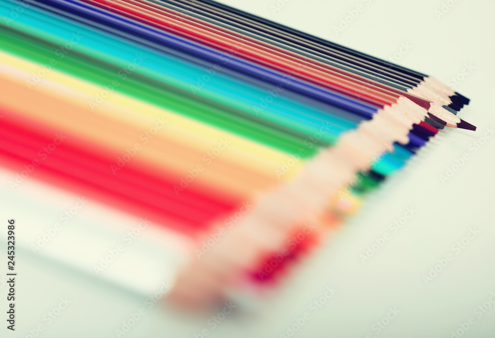colored pencils lying in row colored pencils lying in row