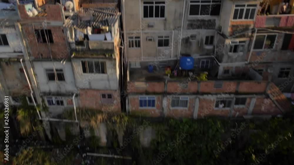Favela Aerials: Rising past houses at sunrise on mountain, Rio de Janeiro, Brazil Favela Aerials: Rising past houses at sunrise on mountain, Rio de Janeiro, Brazil
