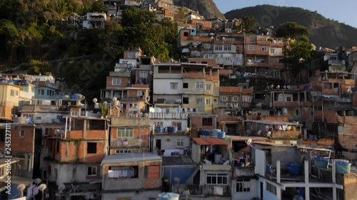 Favela Aerials: Rising past houses at sunrise on mountain, Rio de Janeiro, Brazil photo