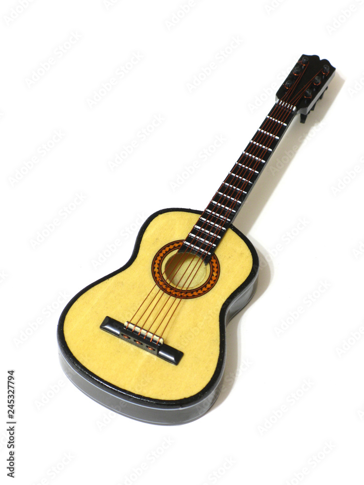 Fototapeta premium Classical acoustic guitar on white isolated background, macro