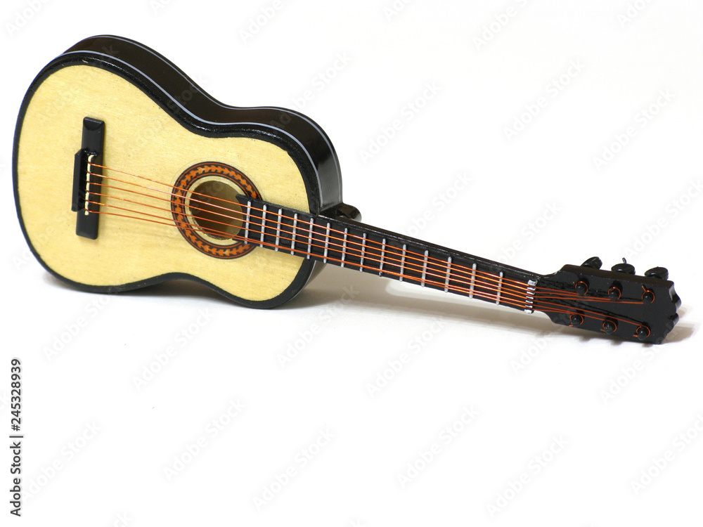 Fototapeta premium Classical acoustic guitar on white isolated background, macro