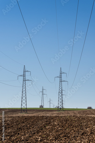 Wallpaper Mural cultivated field and poles of electric current Torontodigital.ca