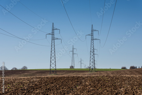 Wallpaper Mural cultivated field and poles of electric current Torontodigital.ca
