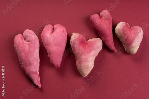 Handmade hearts on red background. Valentines day