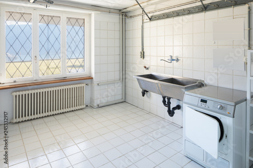 Photography Laundry with washing machine, white tiles and lake view