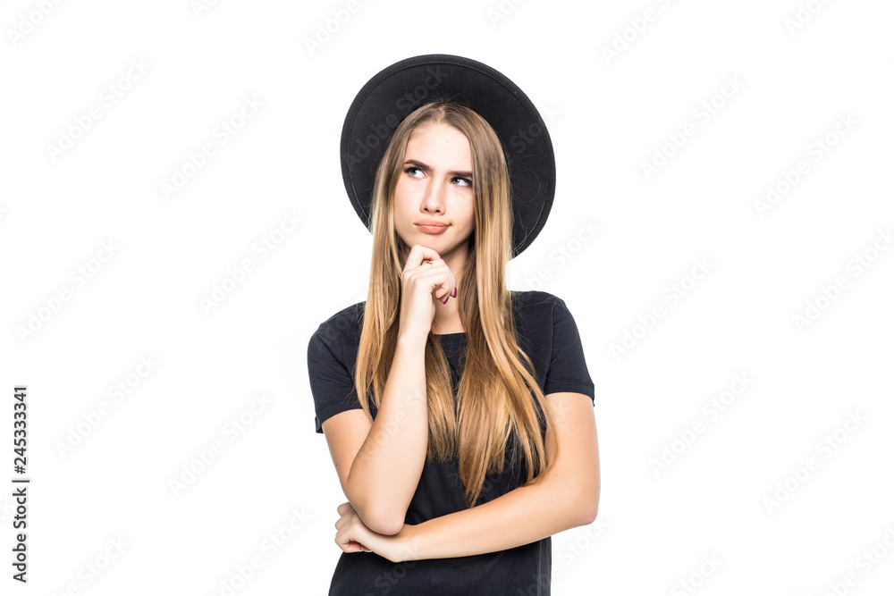 Portrait of young woman in black floppy hat posing isolated on white background.