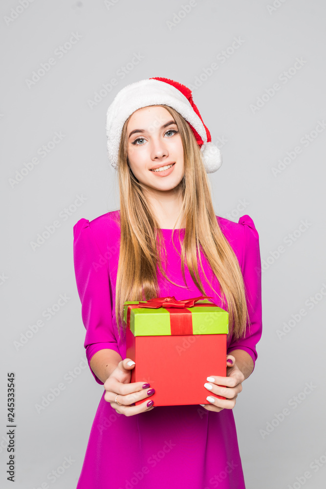 Young woman in dress holding gift box. Smiling christmas girl isolated portrait. Young woman in dress holding gift box. Smiling christmas girl isolated portrait.