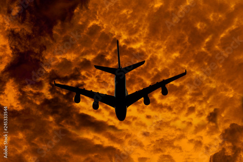 silhouette of airplane on fire background