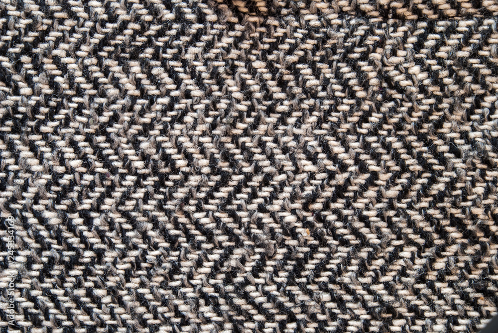 Light grey woolen or tweed fabric for grunge background