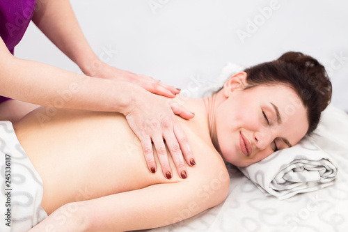 The girl relaxes on reception at the masseur