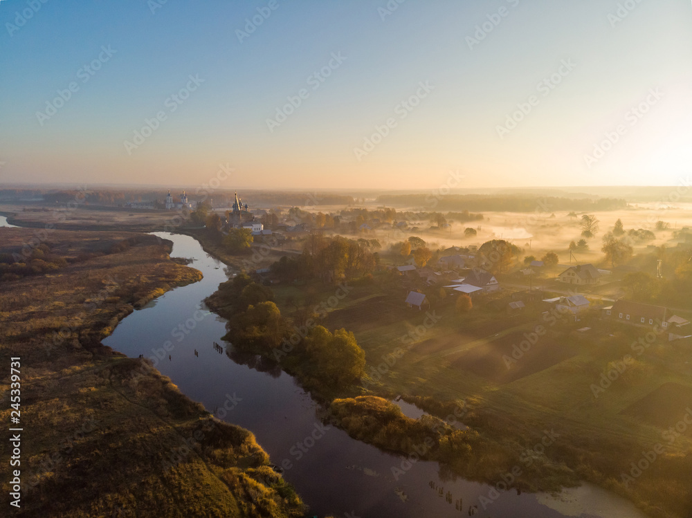 Dunilovo village, Ivanovo region, fog at sunrise in the fall. Shooting from the drone