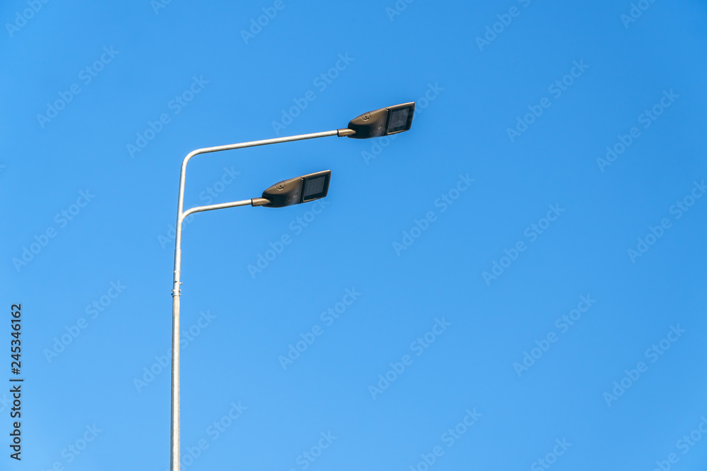 street lighting, supports for ceilings with led lamps. concept of modernization and maintenance of lamps, place for text, day street lighting, supports for ceilings with led lamps. concept of modernization and maintenance of lamps, place for text, day