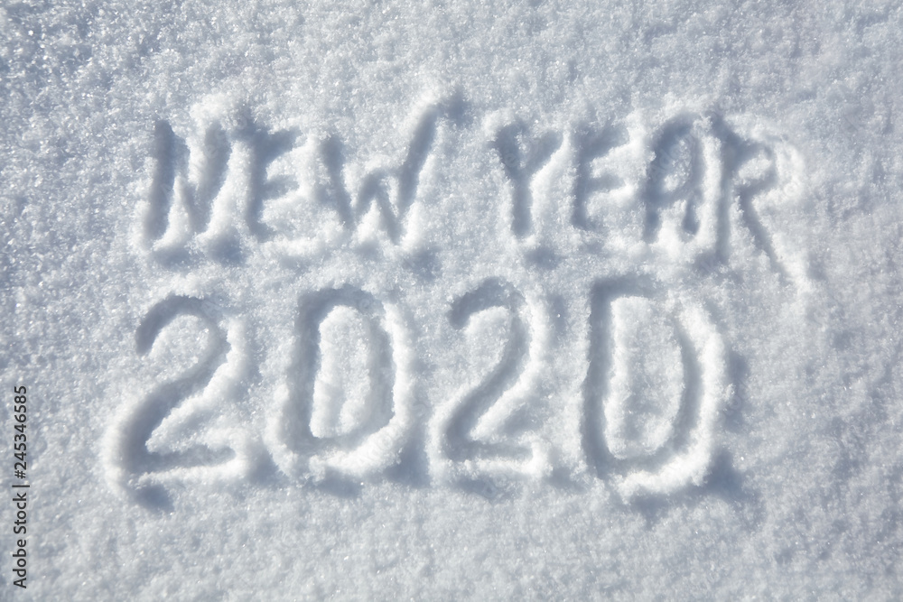 Inscription New Year 2020, winter background, text on snow surface Inscription New Year 2020, winter background, text on snow surface