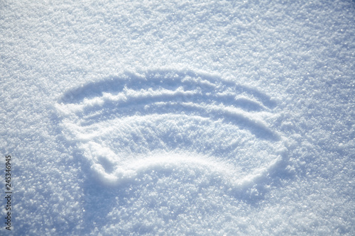 erased inscription on the snowy surface, winter background