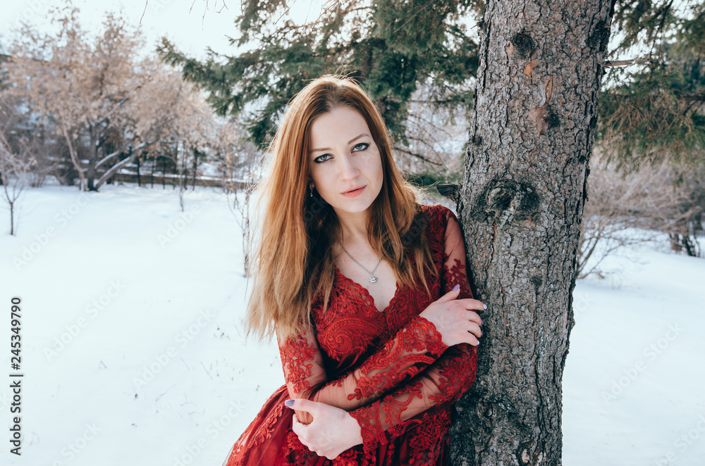 Outdoor photo of romantic lady in red dress Outdoor photo of romantic lady in red dress