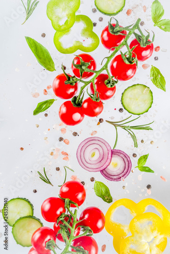 Vegan healthy food concept. Ingredients cooking spring vitamin salad. Fresh vegetable simple pattern  layout with tomatoes  onions  herbs and spices on white background. Top view banner copy space