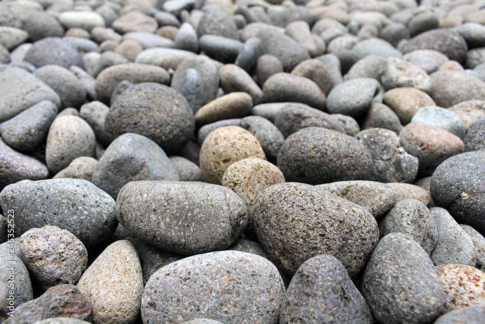 A close up view on pebbles and stones as natural decoration in the garden. A close up view on pebbles and stones as natural decoration in the garden.