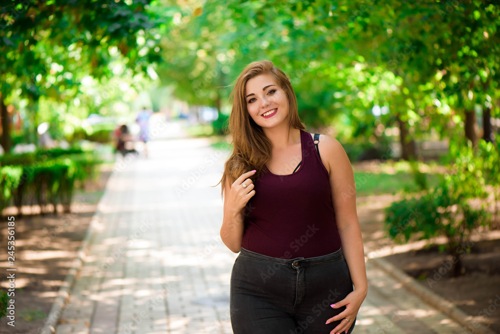 Single Young Pretty Plus Size Caucasian Happy Smiling Laughing Girl Woman, Walking In Summer Green Forest. Fun Enjoy Outdoor Summer Nature. Single Young Pretty Plus Size Caucasian Happy Smiling Laughing Girl Woman, Walking In Summer Green Forest. Fun Enjoy Outdoor Summer Nature.