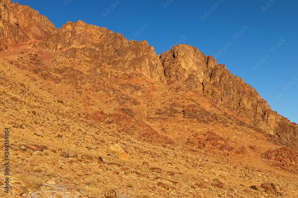 Picturesque landscape of rocky mountain peaks in winter morning. Sinai Mountain (Mount Horeb, Gabal Musa, Moses Mount). Sinai Peninsula of Egypt. Pilgrimage place and famous touristic destination