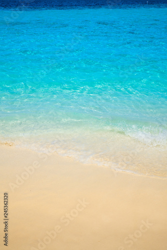 Wave of tropical sea beach on white sand © happystock