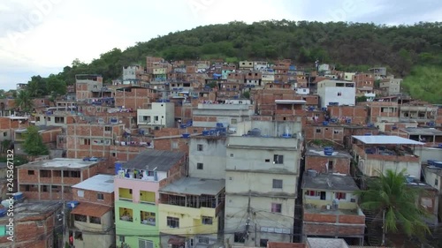 Favela Aerial: Slow backwards reveal close to favela houses in Rio de Janeiro, Brasil photo