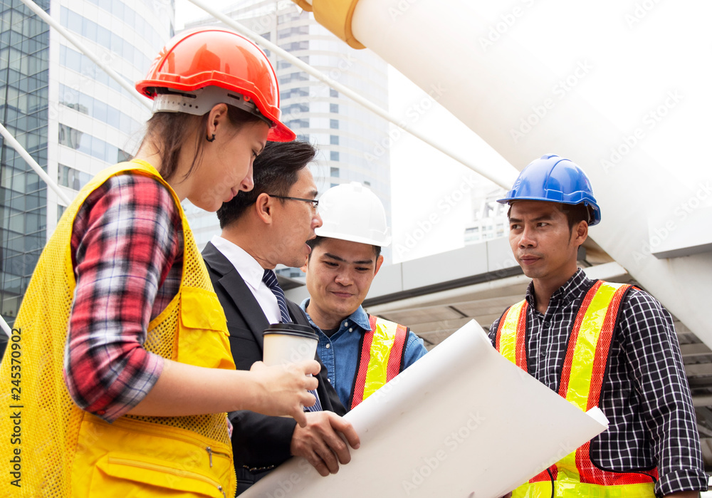 Engineering and customer holding home construction paper for work concept. Engineering and customer holding home construction paper for work concept.