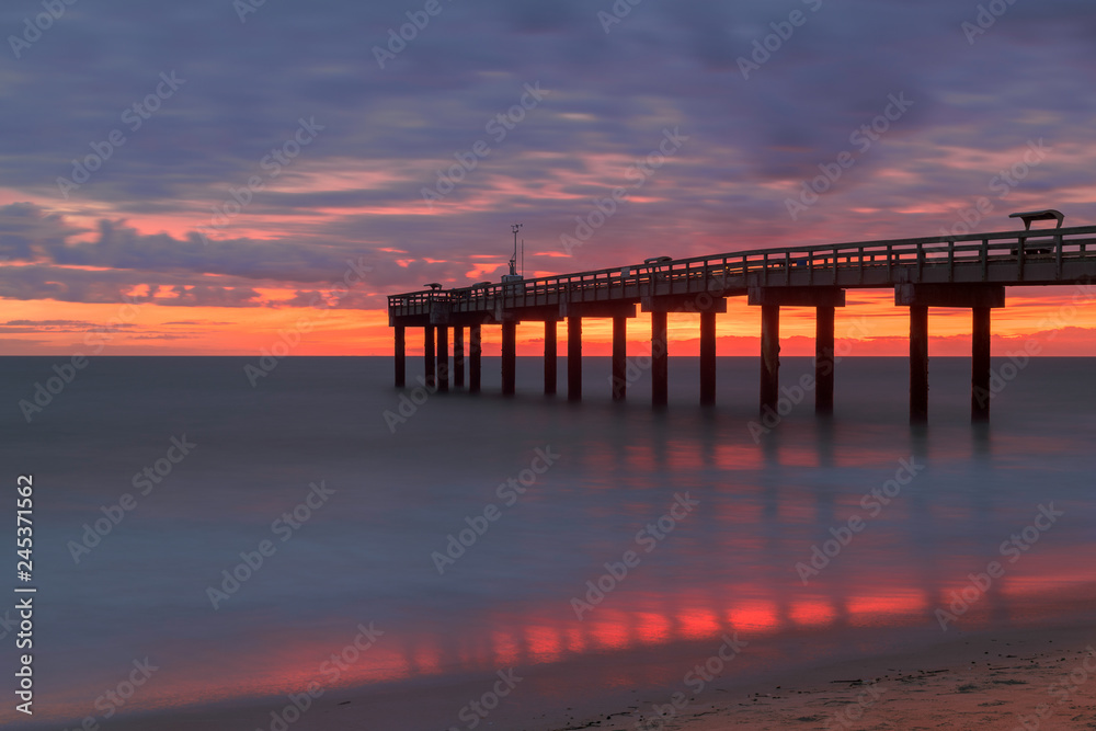 Sunrise over the Atlantic Ocean at St. Augustine Beach Pier in St. Augustine, Florida