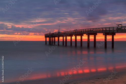 Sunrise over the Atlantic Ocean at St. Augustine Beach Pier in St. Augustine, Florida © gnagel